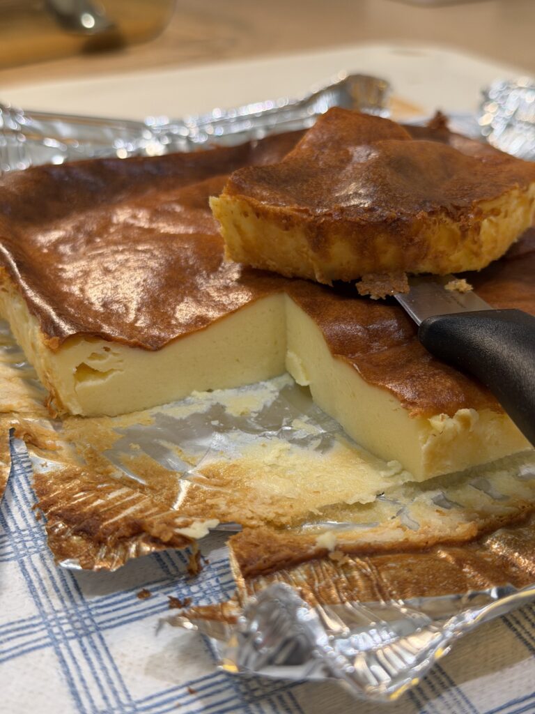 Close-up of a freshly baked Basque burnt cheesecake showing the creamy lava center and caramelized top